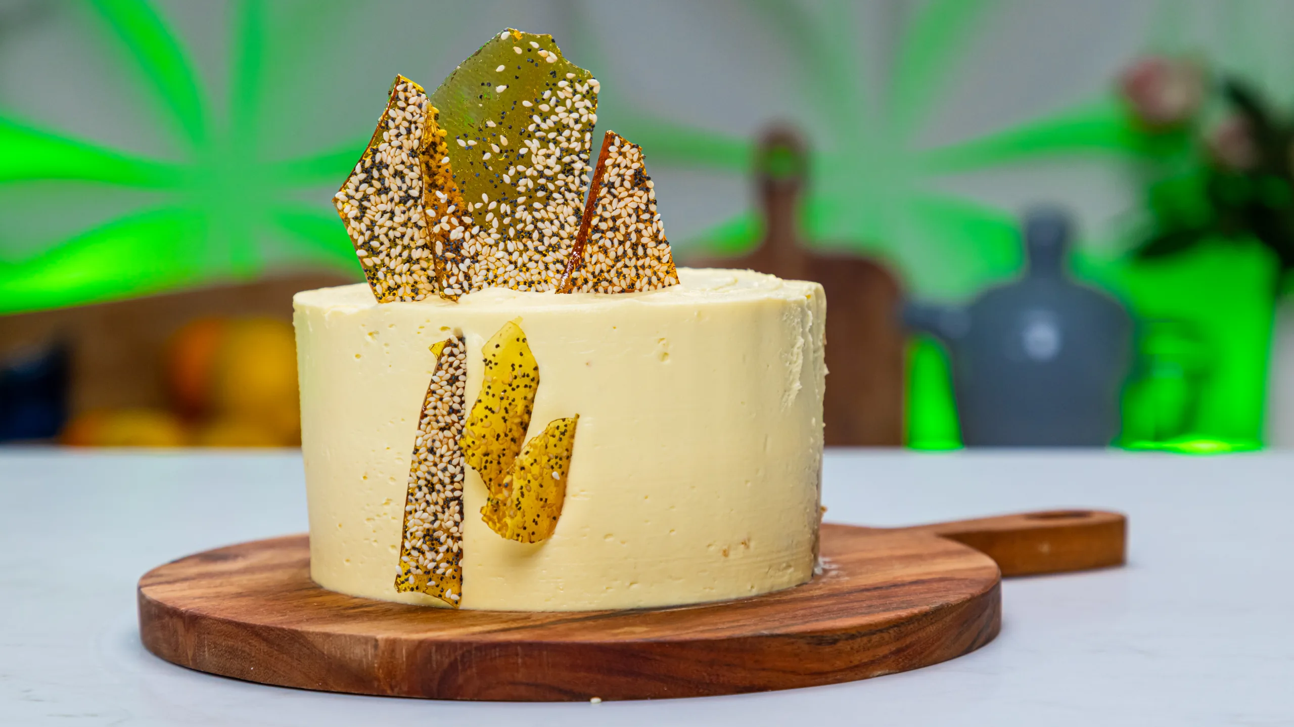 Orange poppy seed cake with smooth buttercream frosting, topped with sesame and poppy seed brittle shards. The winning cake recipe on Taste Master SA Season 6 Episode 1 on SABC2.